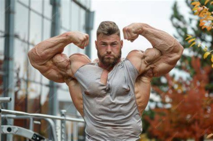 Bodybuilders flex their pecs at Muscle Beach
